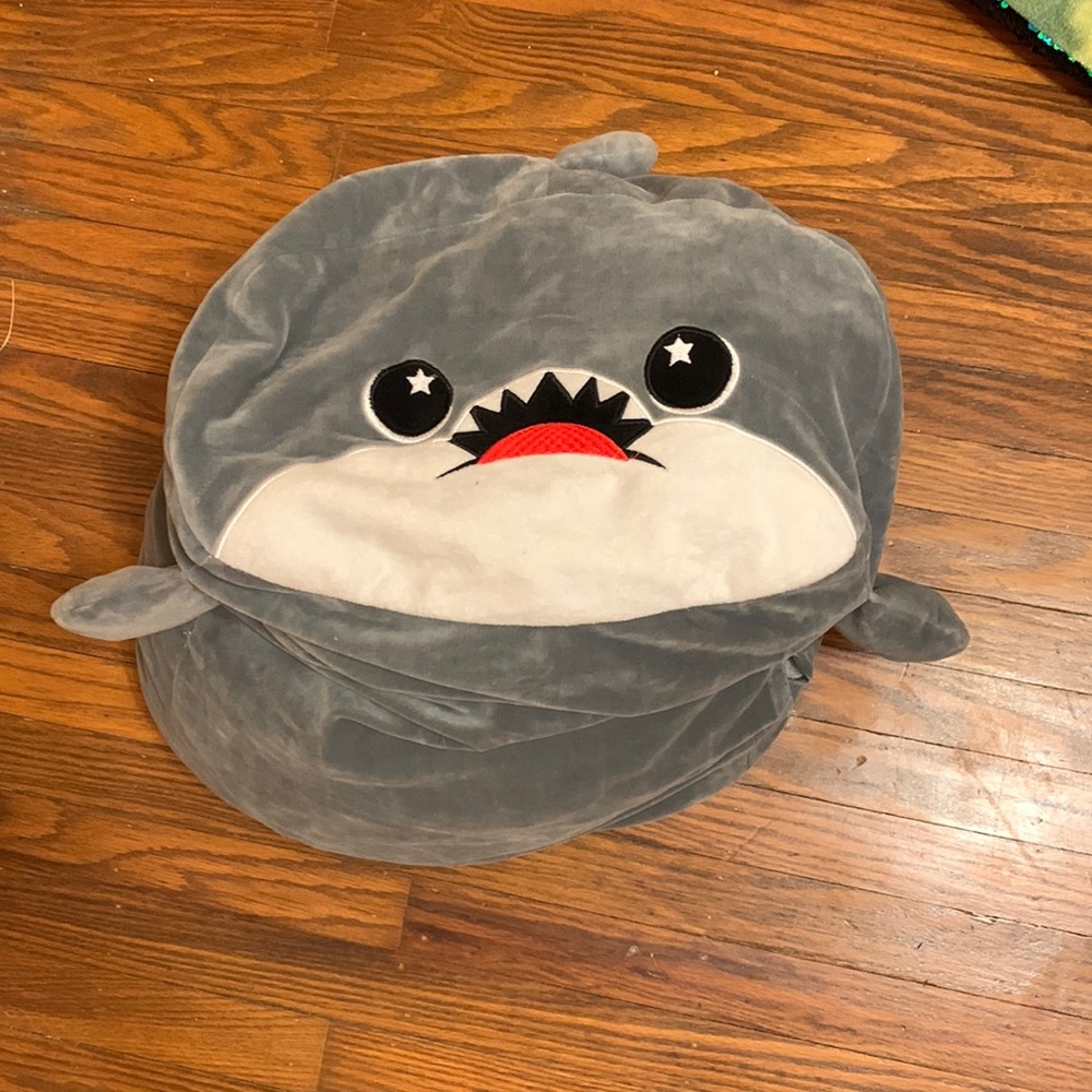This is a grey squishmallaw shark